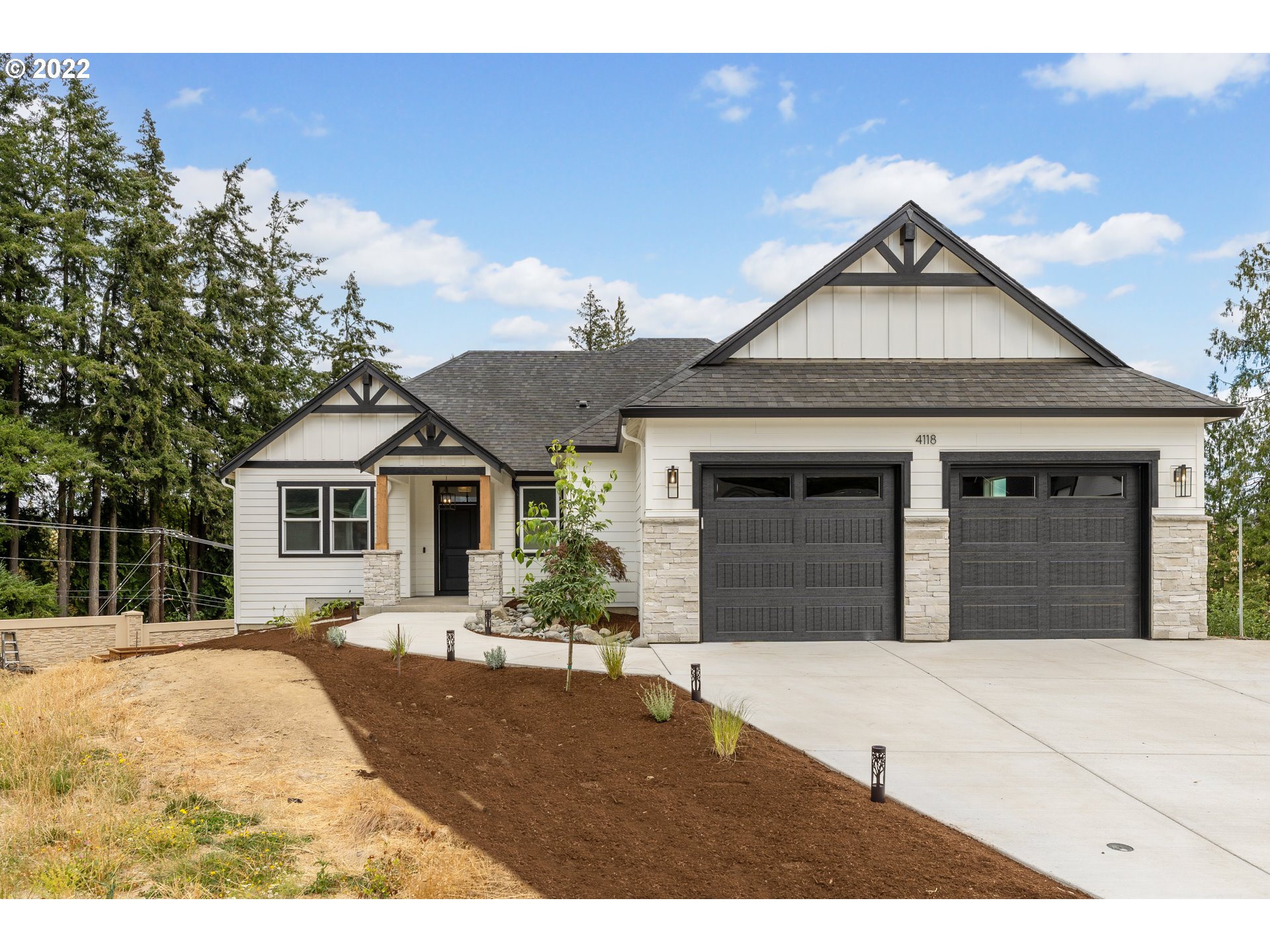 4118 South Hay Field Circle Ridgefield, WA 98642 - Photo 1 of 19 a front view of a house with a yard
