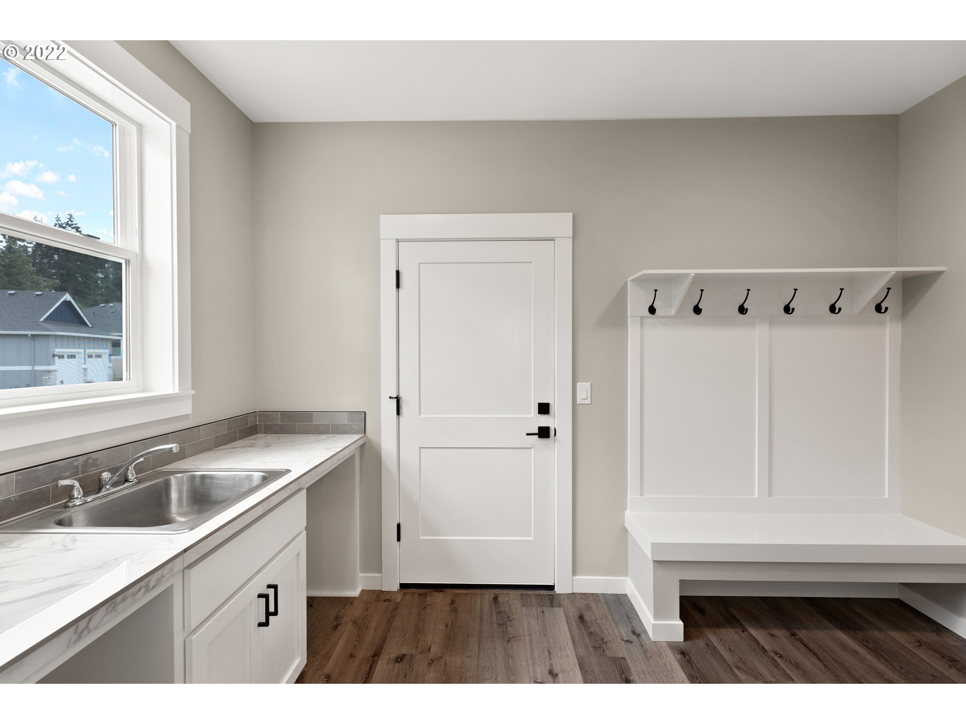 4118 South Hay Field Circle Ridgefield, WA 98642 - Photo 11 of 19 a kitchen with a sink cabinets and a window