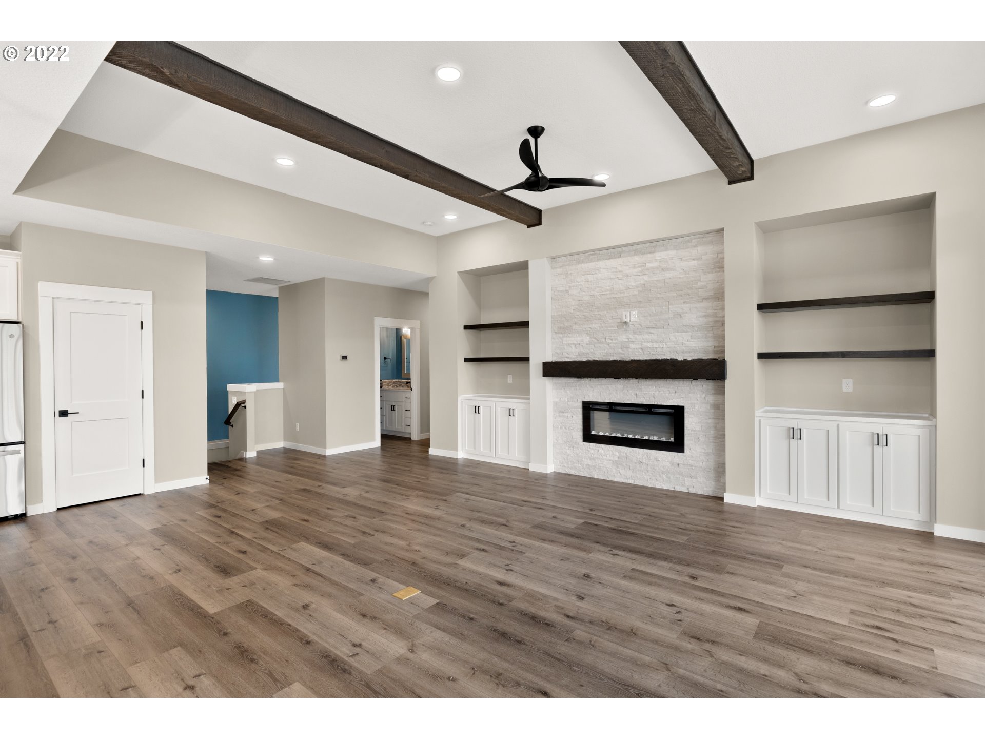 4118 South Hay Field Circle Ridgefield, WA 98642 - Photo 13 of 19 a view of empty room with wooden floor and fireplace