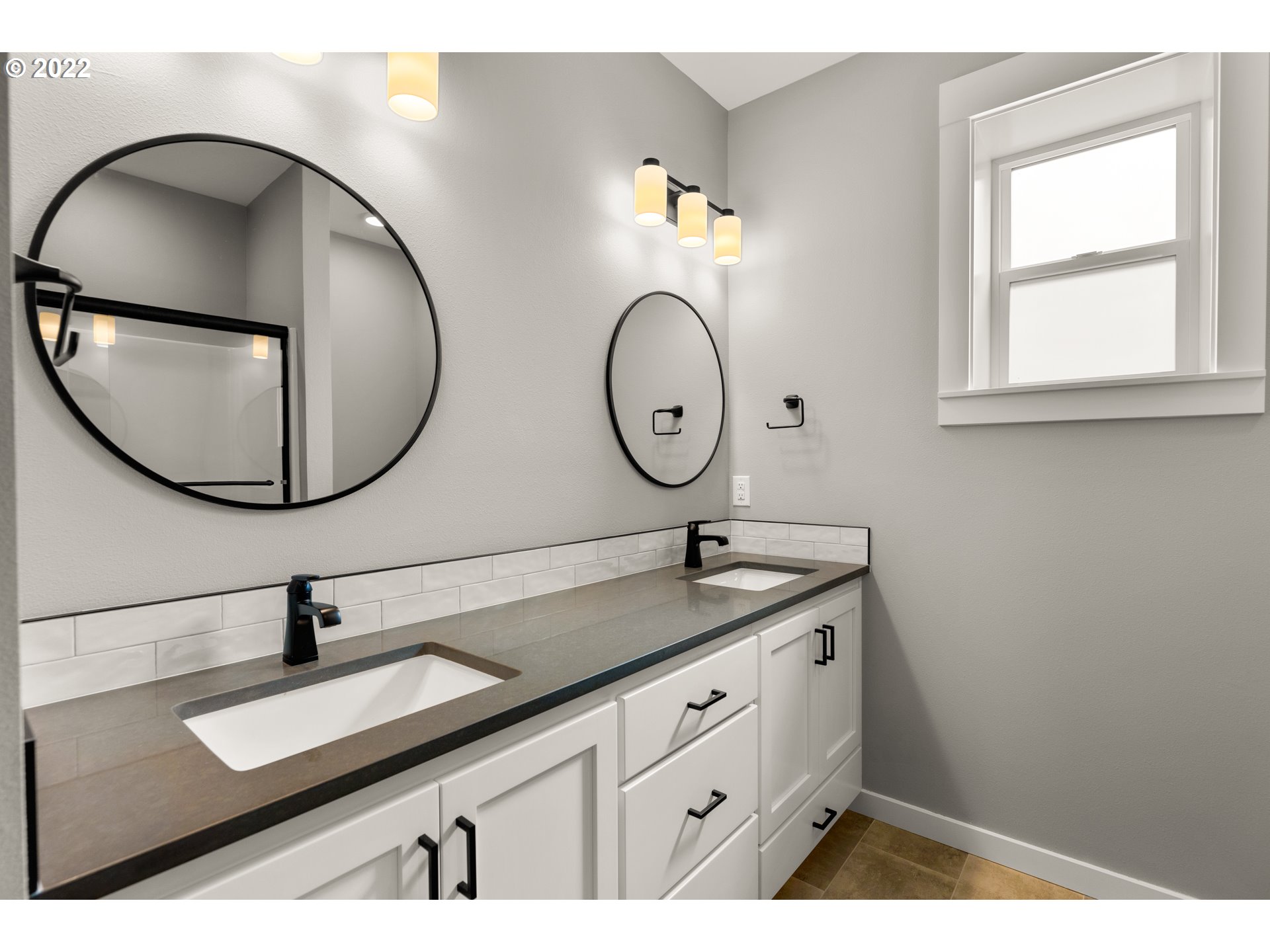 4118 South Hay Field Circle Ridgefield, WA 98642 - Photo 14 of 19 a bathroom with a sink and a mirror