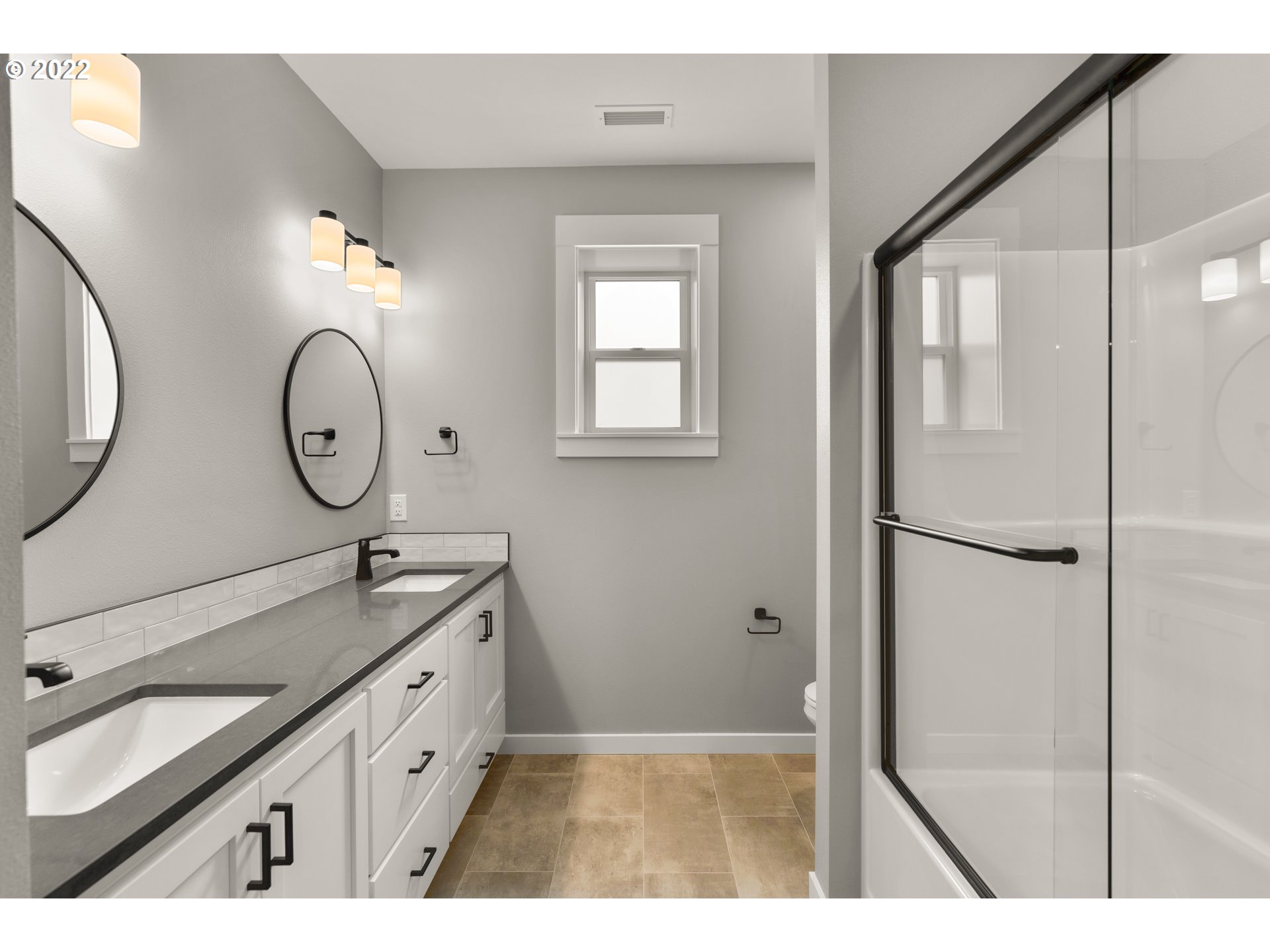 4118 South Hay Field Circle Ridgefield, WA 98642 - Photo 15 of 19 a bathroom with a double vanity sink mirror and toilet