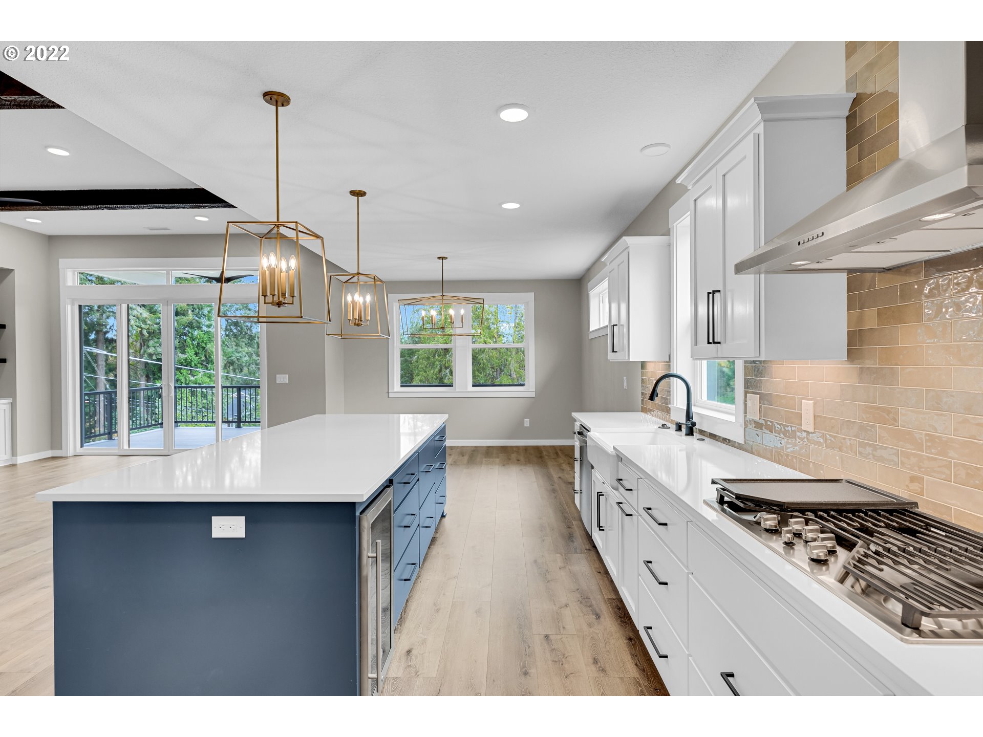 4118 South Hay Field Circle Ridgefield, WA 98642 - Photo 8 of 19 a kitchen with stainless steel appliances granite countertop a sink a stove and a wooden floors
