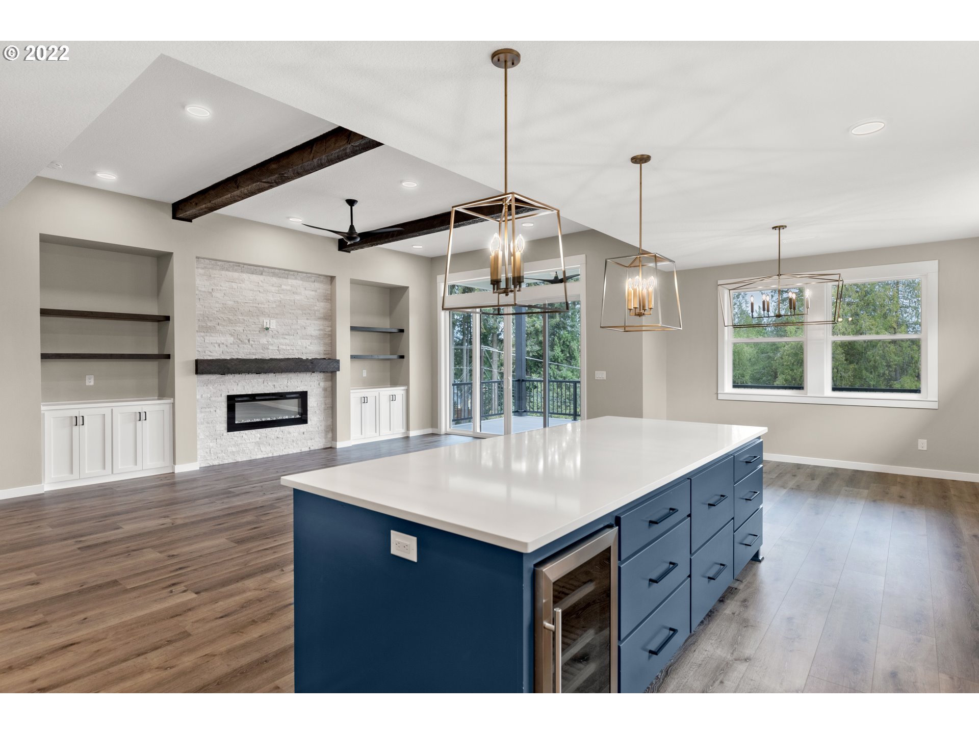 4118 South Hay Field Circle Ridgefield, WA 98642 - Photo 9 of 19 a kitchen with a wooden floor and a large window