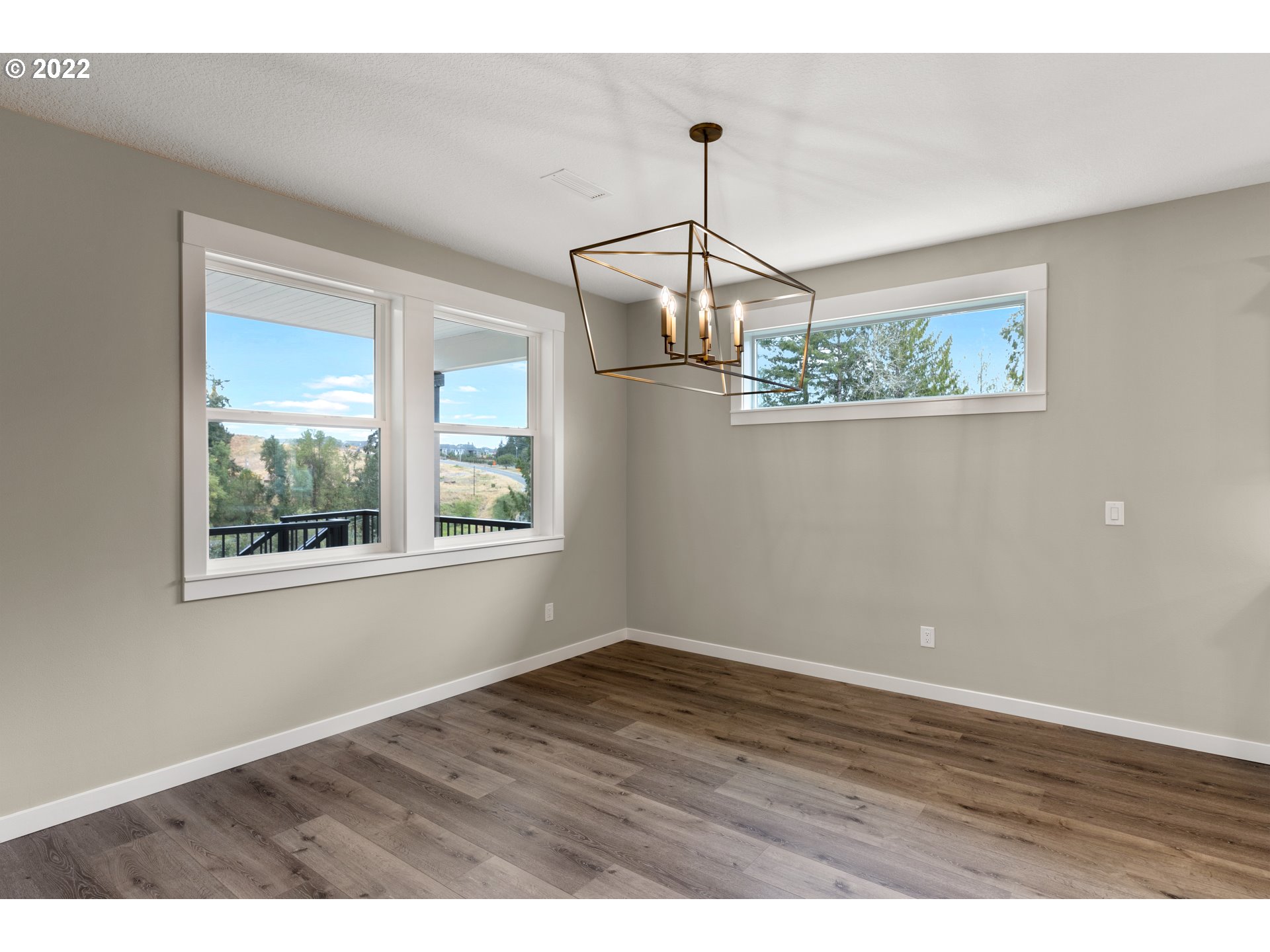 4118 South Hay Field Circle Ridgefield, WA 98642 - Photo 10 of 19 a view of an empty room with wooden floor and a window