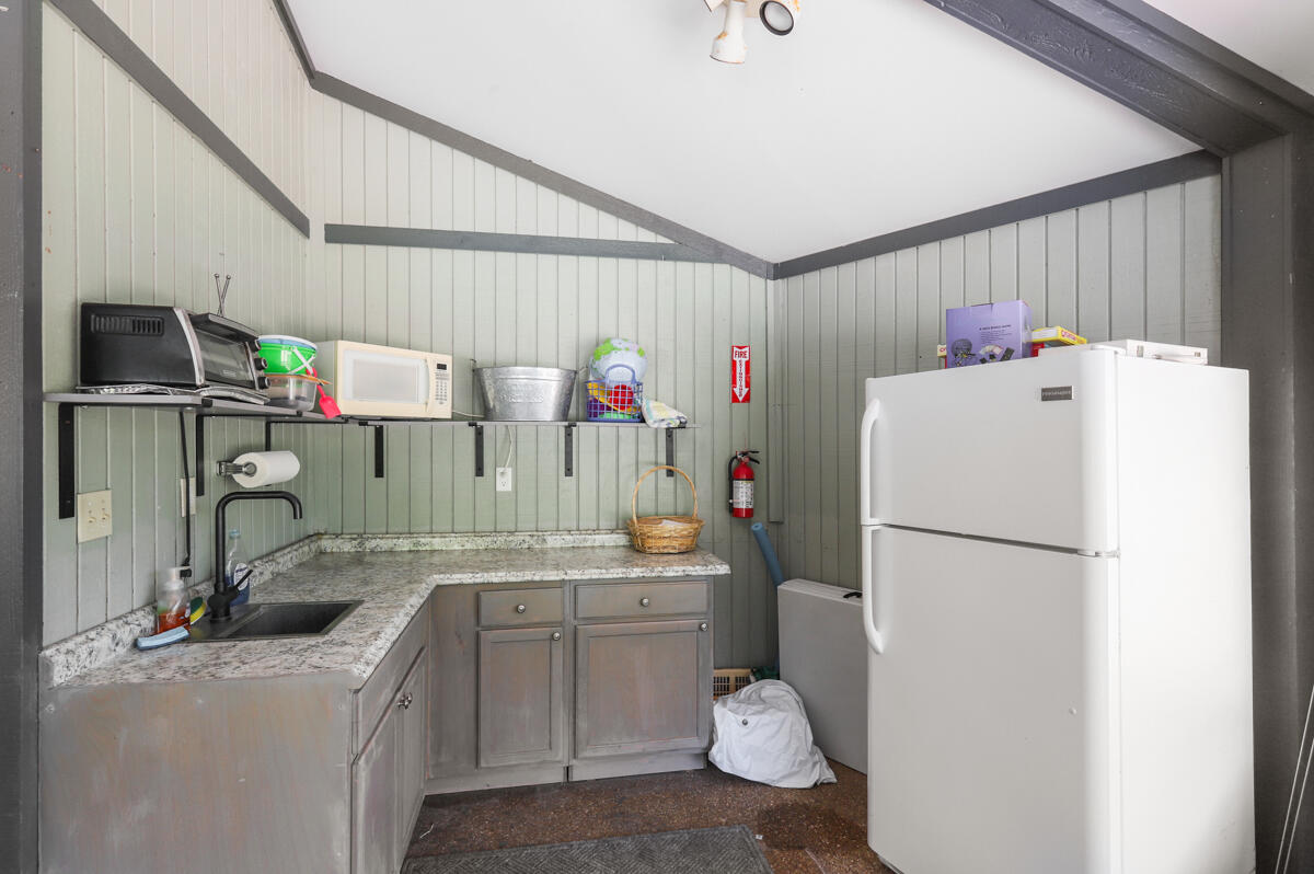 8356 Southeast Croft Circle, Unit O3 Hobe Sound, FL 33455 - Photo 20 of 23 a utility room with dryer and washer