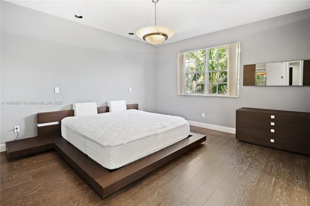 a bed room with a bed and a window