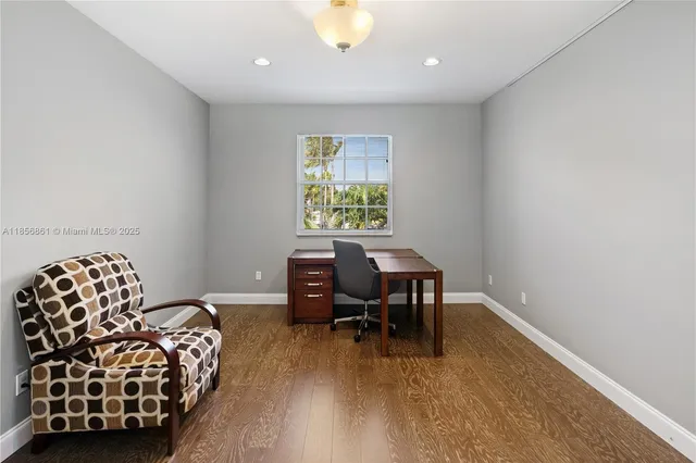 a workspace with furniture and window