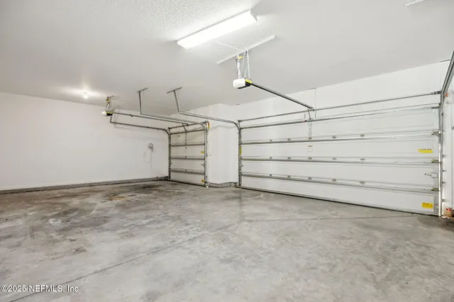 an empty room with a empty space and a ceiling fan