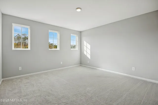 a living room with hardwood floor and a garden