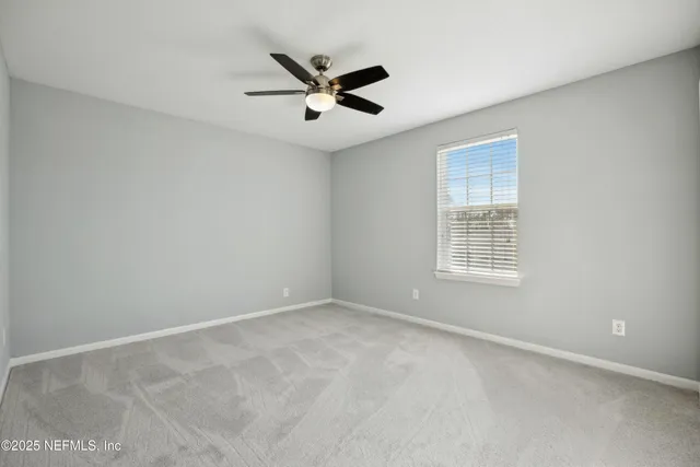 a view of an empty room with a balcony