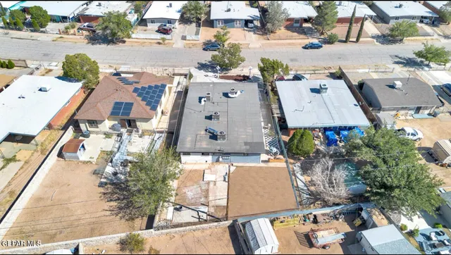 a view of a terrace with furniture and a floor to ceiling window