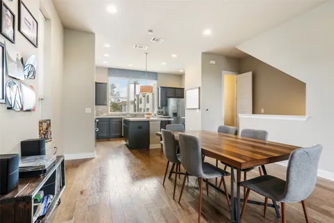 a view of kitchen with cabinets and wooden floor