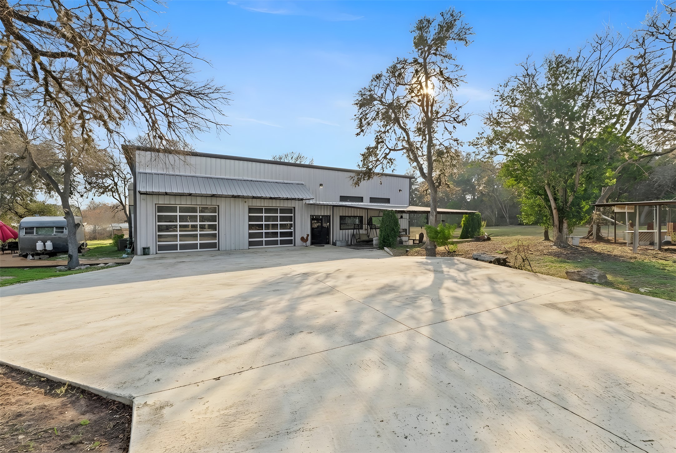 12302 Bethel Church Road Manchaca, TX 78652 - Photo 1 of 35 View of front facade with driveway and a garage