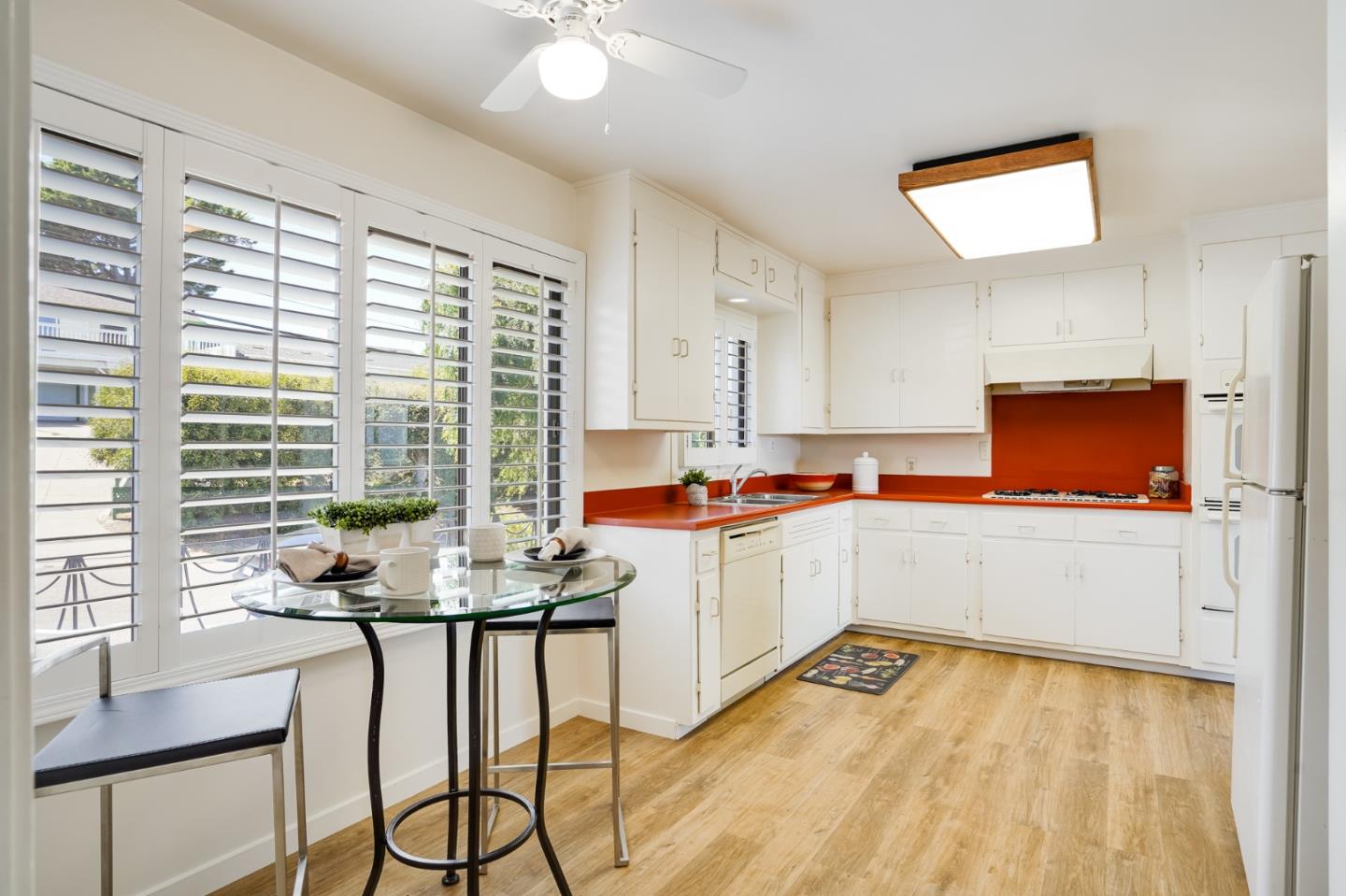 1273 Vista Grande Millbrae, CA 94030 - Photo 11 of 50 a kitchen with a table chairs stove and cabinets