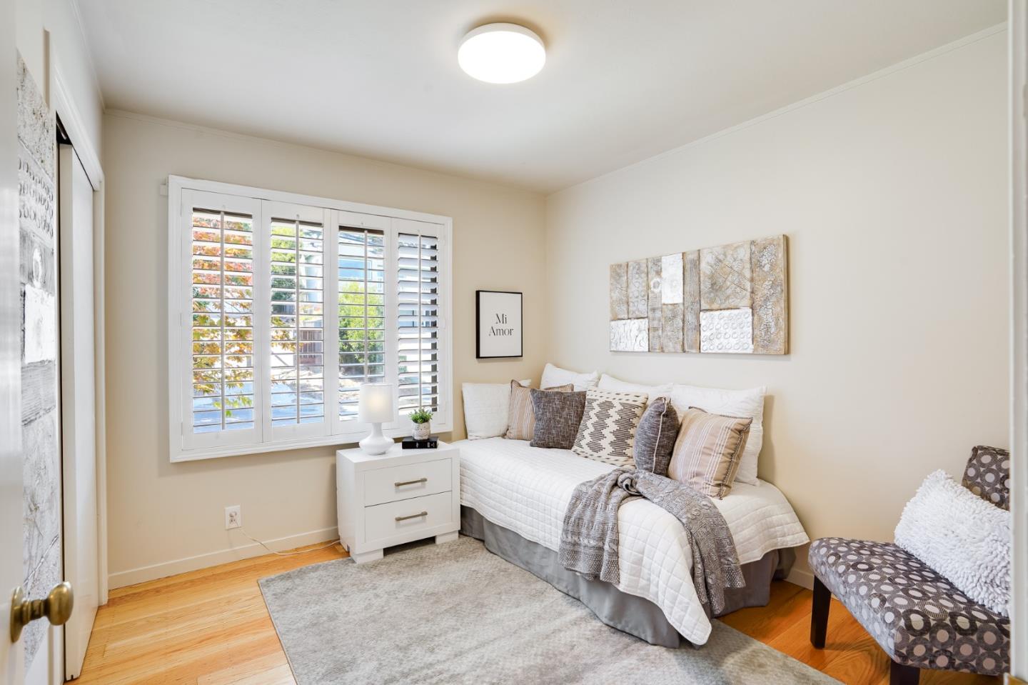 1273 Vista Grande Millbrae, CA 94030 - Photo 18 of 50 a spacious bedroom with a bed and a couch