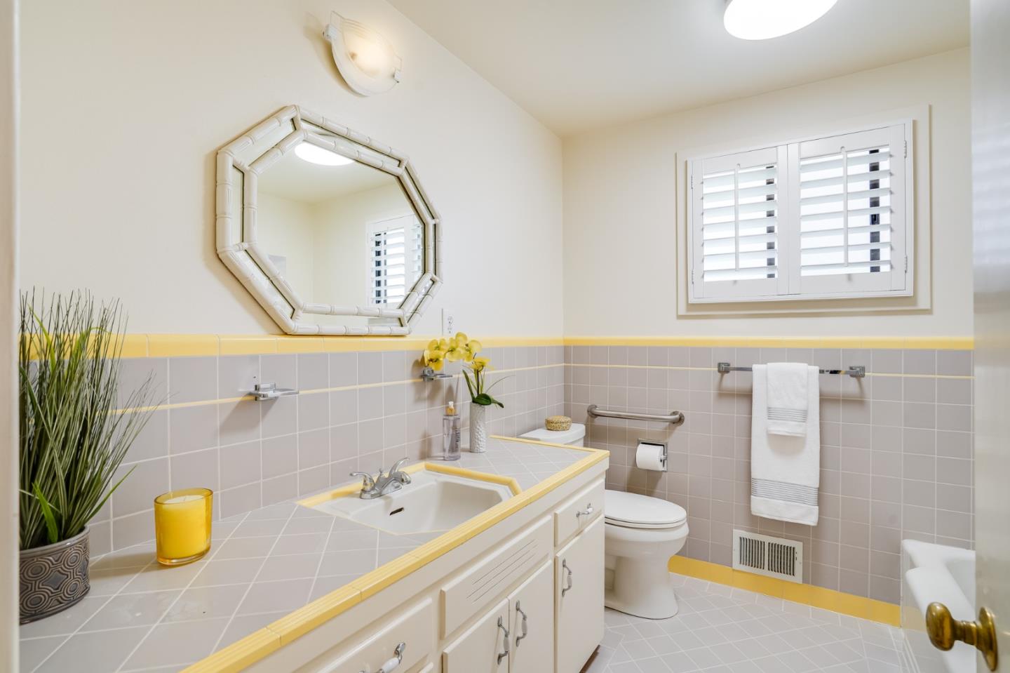 1273 Vista Grande Millbrae, CA 94030 - Photo 22 of 50 a bathroom with a sink a toilet and a mirror
