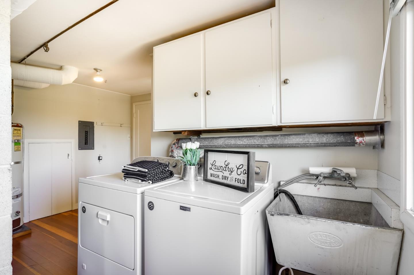 1273 Vista Grande Millbrae, CA 94030 - Photo 26 of 50 a kitchen with a stove a sink and a refrigerator