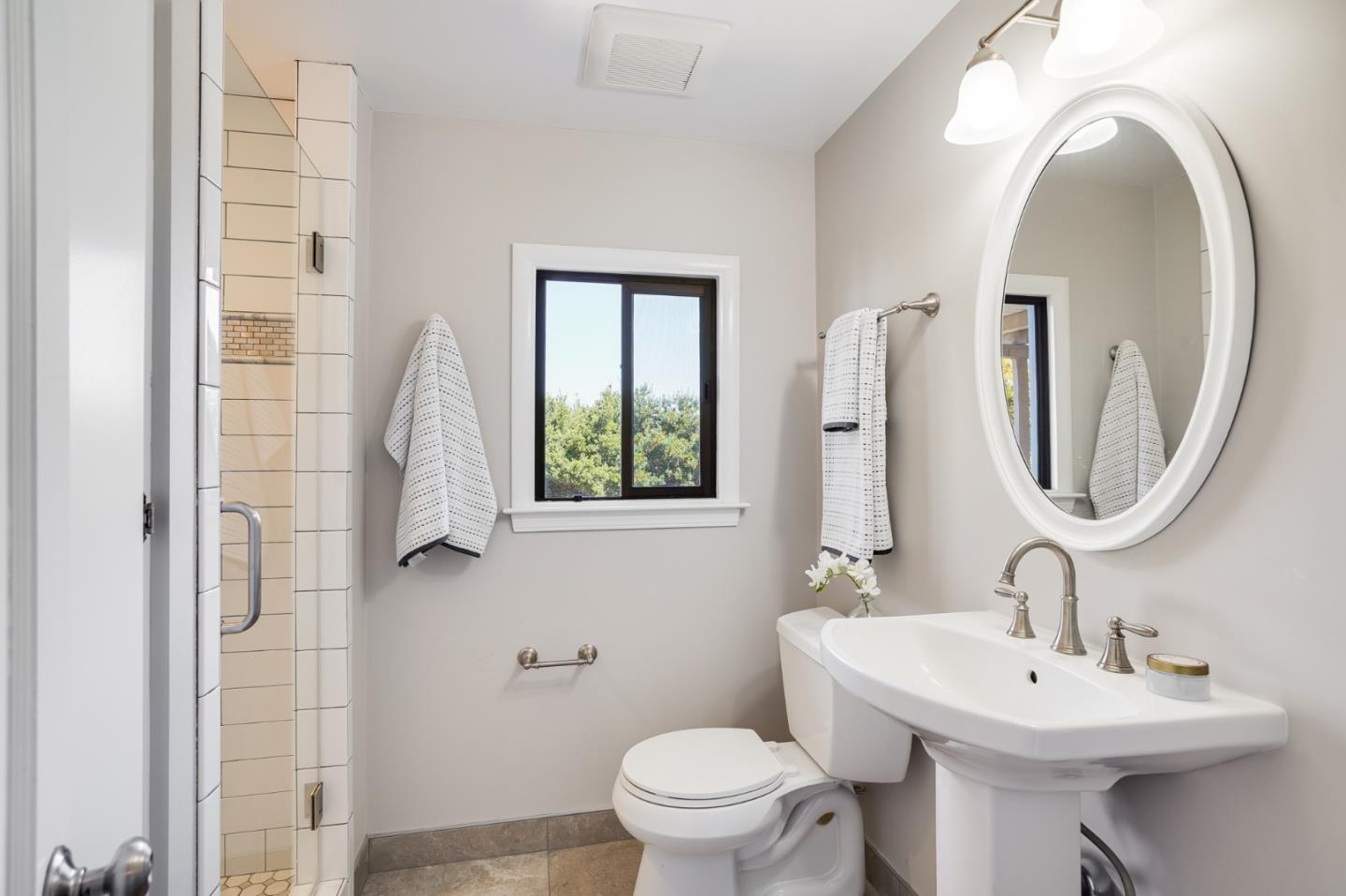 1273 Vista Grande Millbrae, CA 94030 - Photo 27 of 50 a bathroom with a sink a toilet and a mirror