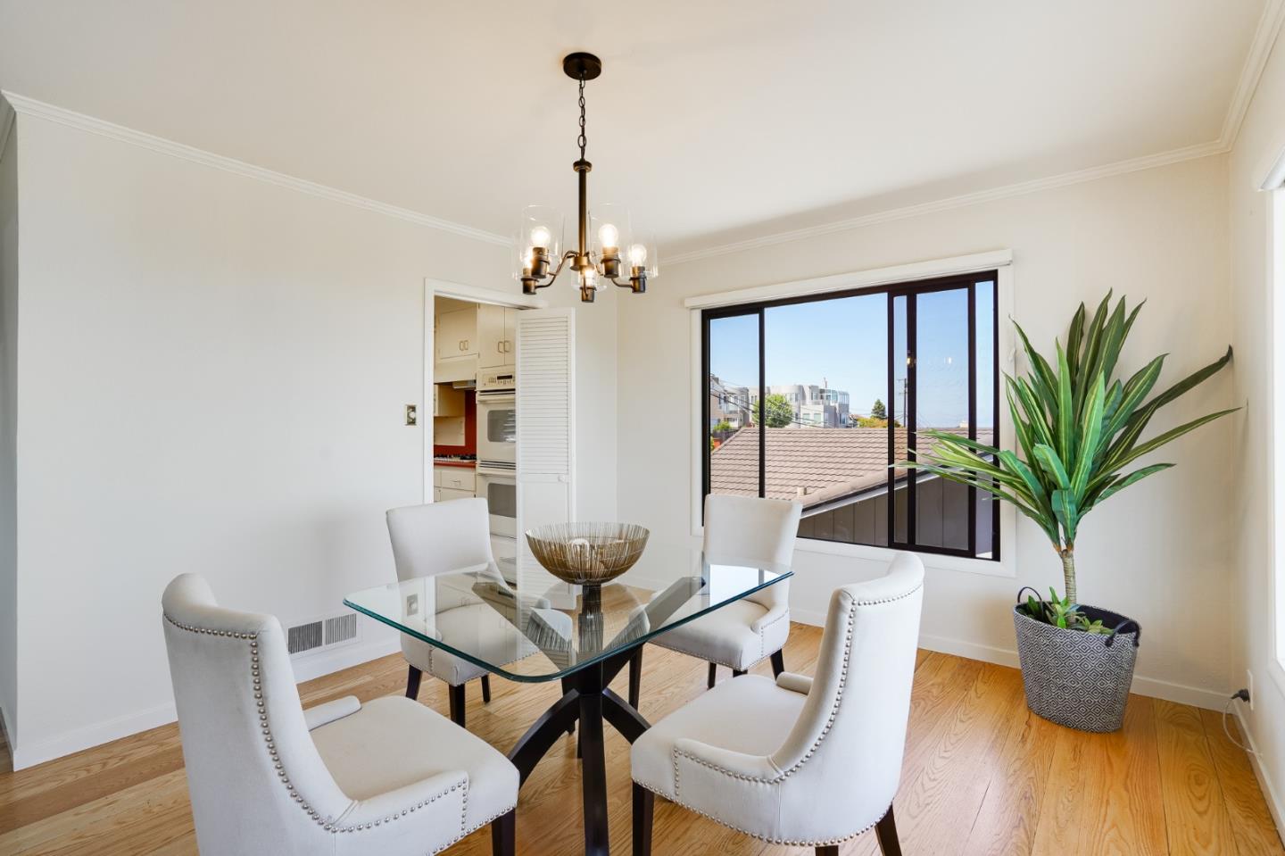 1273 Vista Grande Millbrae, CA 94030 - Photo 8 of 50 a view of a dining room with furniture wooden floor and chandelier