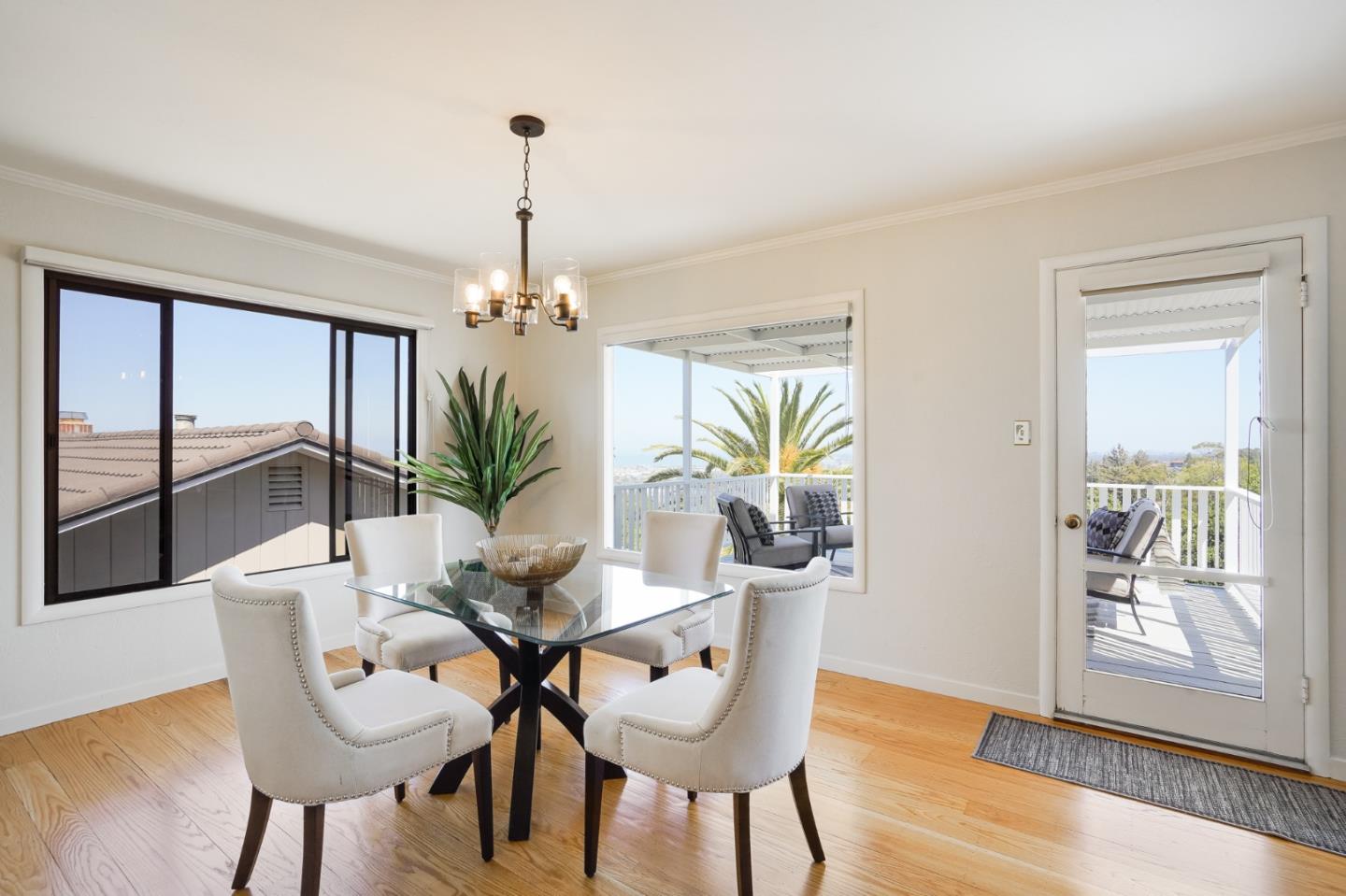 1273 Vista Grande Millbrae, CA 94030 - Photo 9 of 50 a dining room with furniture a chandelier and wooden floor