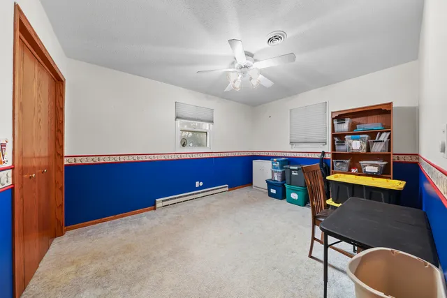 a room with furniture and a bookshelf