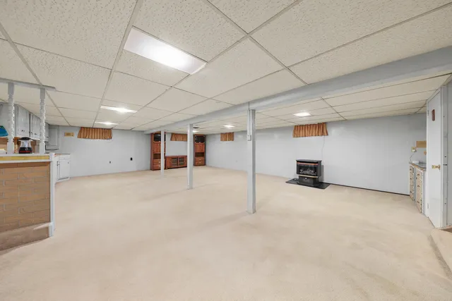 a kitchen with stainless steel appliances a refrigerator and window