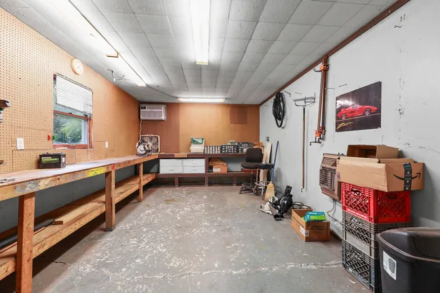a view of kitchen with furniture and a refrigerator