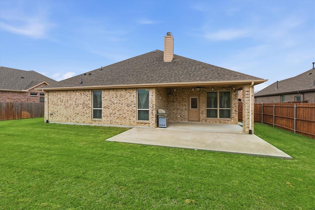 215 Equestrian Road Hickory Creek, TX 75065 - Photo 31 of 36 a front view of a house with a garden