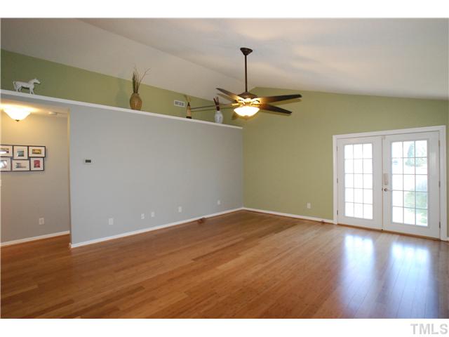 4300 Standing Rock Way Raleigh, NC 27604 - Photo 2 of 12 Huge Family Room with Cathedral Ceiling, New Lighted Ceiling Fan & Hardwood Flooring. The New French Doors open to the Fenced Back Yard & Patio.