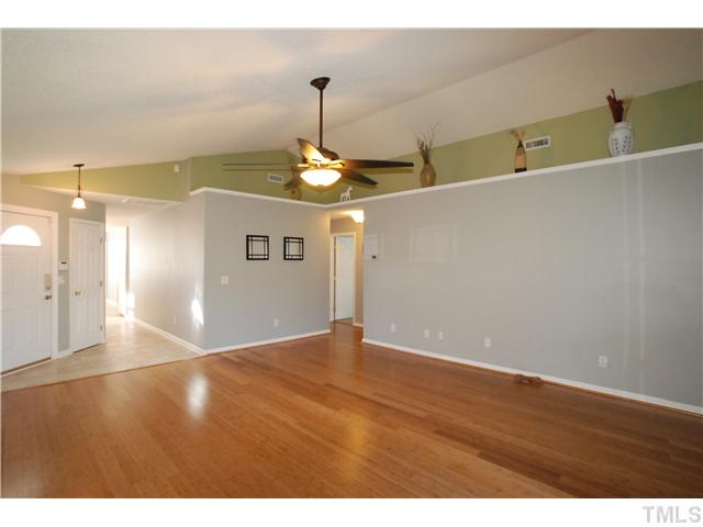 4300 Standing Rock Way Raleigh, NC 27604 - Photo 3 of 12 Entry Foyer has New Ceramic Tile Flooring & Security System Keypad. The Family Room has Fresh Paint & a Decorative Plant Ledge.