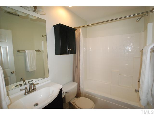 4300 Standing Rock Way Raleigh, NC 27604 - Photo 8 of 12 Master Bath has been totally Upgraded with New Vanity, Sink, Faucet, Lighting, Hardware, Bath Fan w/three times the air movement with a third of the noise, and Ceramic Tile Flooring.