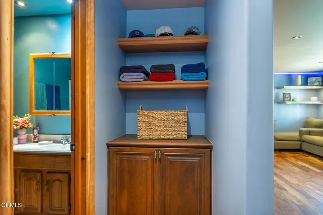 a bathroom with a sink toilet vanity and shower