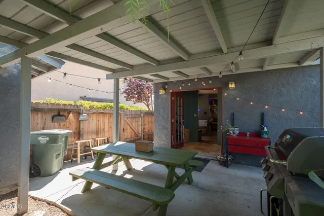 a view of a backyard with plants and a garden
