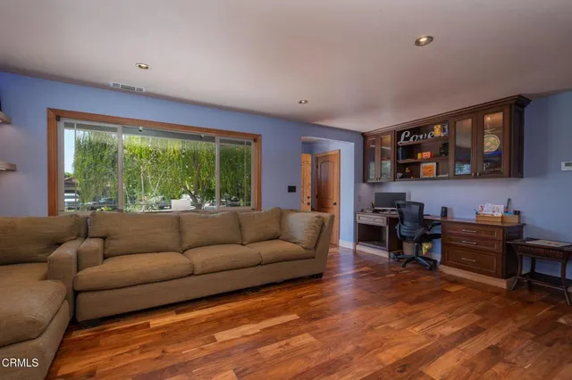 a kitchen with stainless steel appliances granite countertop a refrigerator and a stove