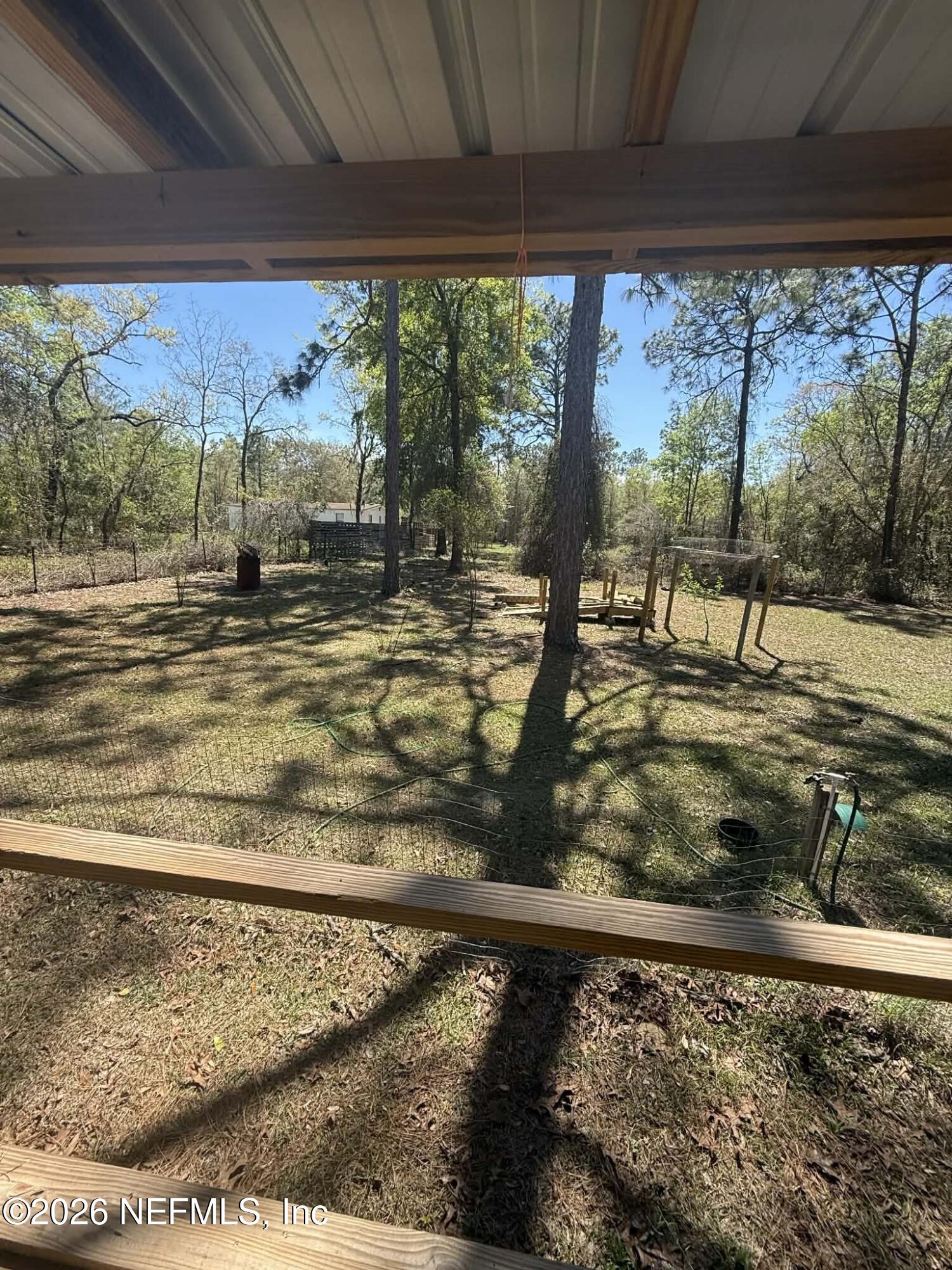6319 Bucknell Avenue Keystone Heights, FL 32656 - Photo 4 of 11 a view of a backyard of a house
