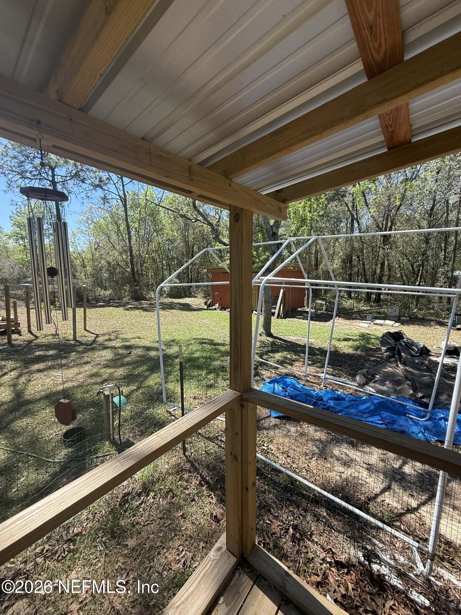 6319 Bucknell Avenue Keystone Heights, FL 32656 - Photo 5 of 11 a view of a porch with wooden floor