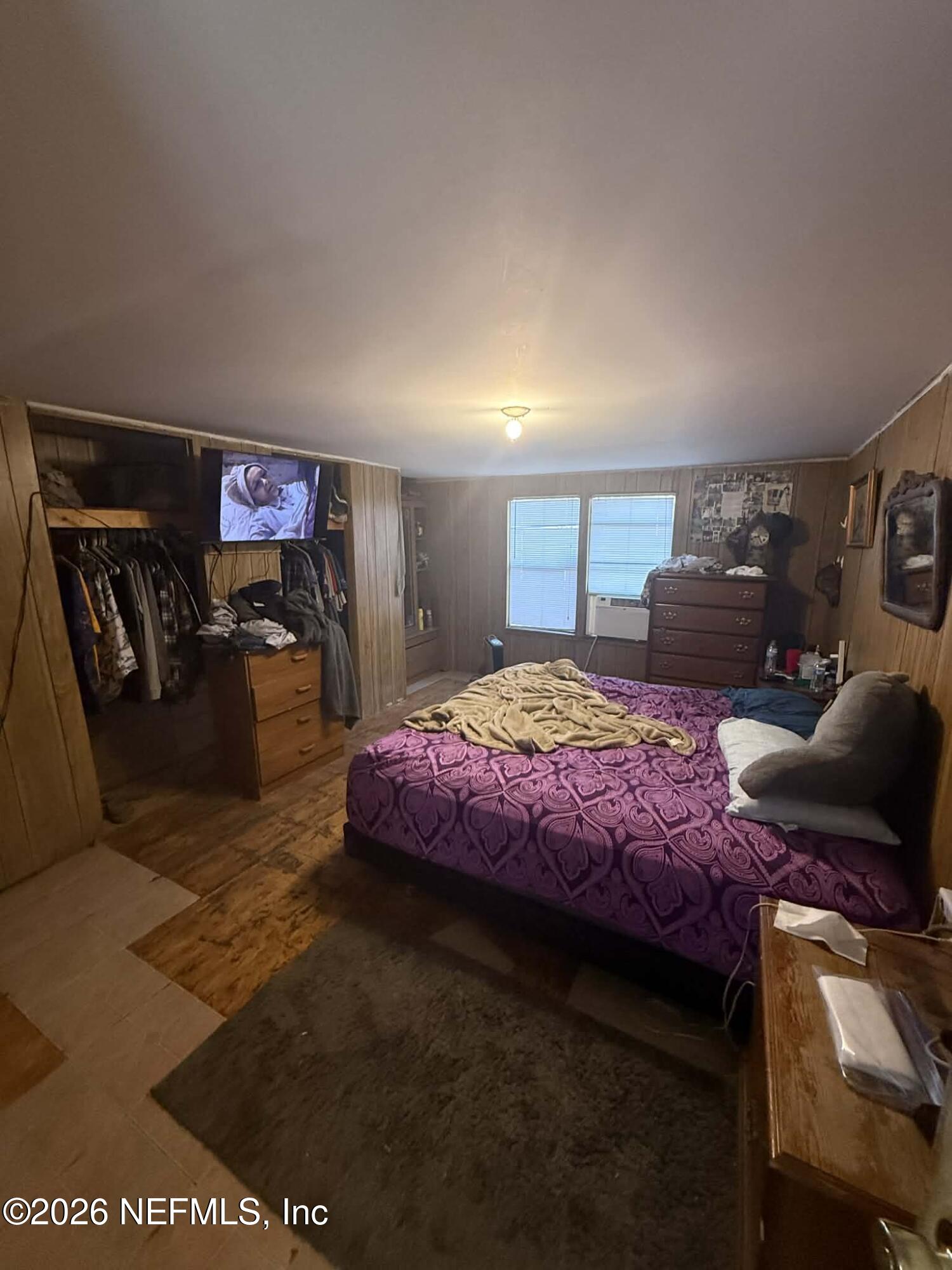 6319 Bucknell Avenue Keystone Heights, FL 32656 - Photo 8 of 11 a bedroom with a bed and a couch
