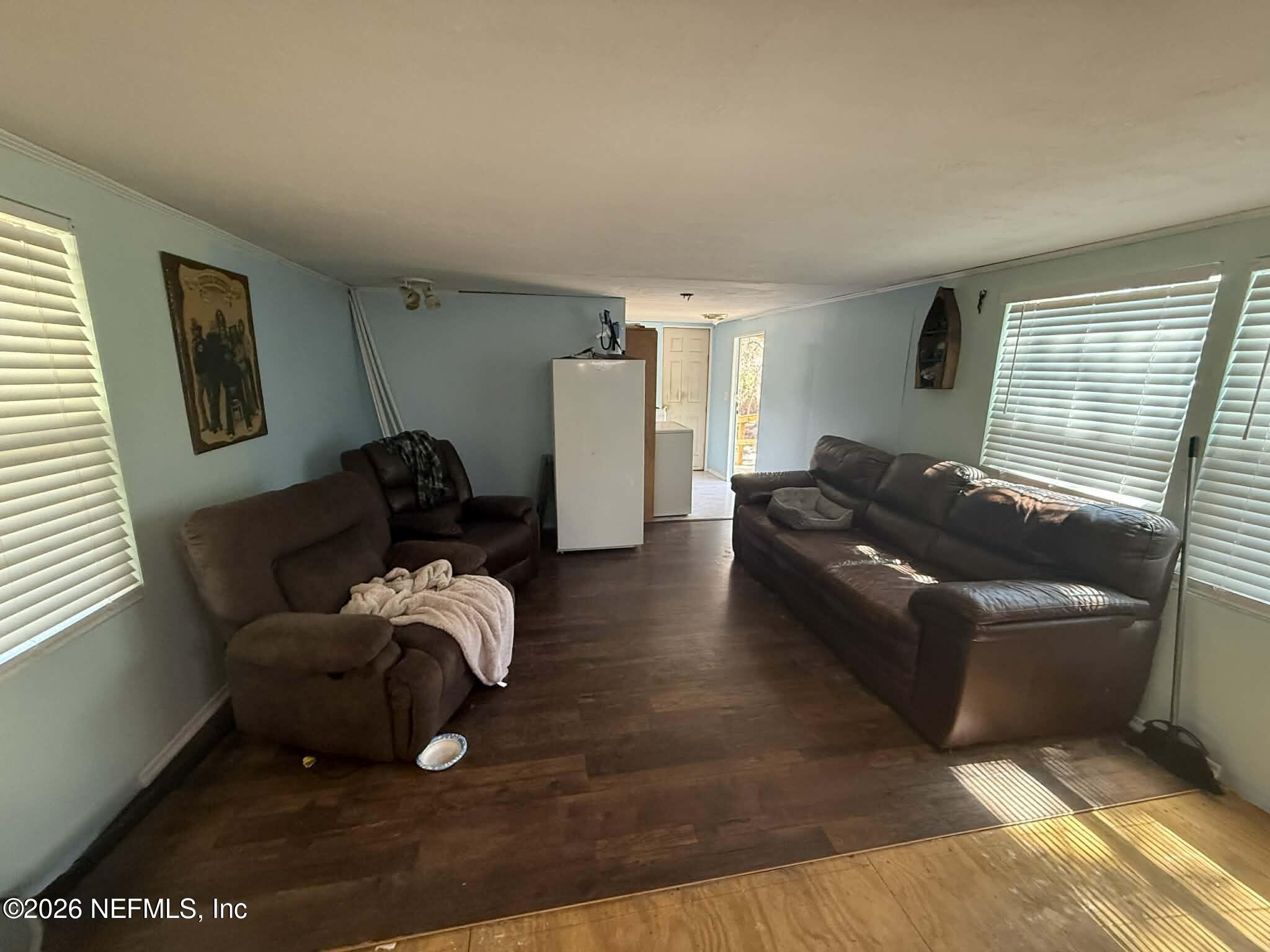 6319 Bucknell Avenue Keystone Heights, FL 32656 - Photo 10 of 11 a living room with furniture rug and a window
