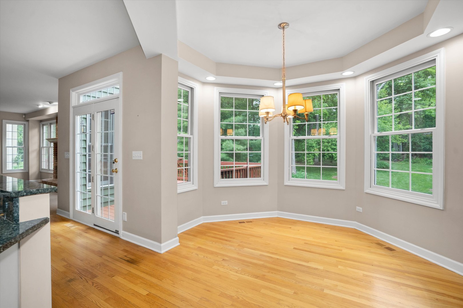 120 Fox Street Cary, IL 60013 - Photo 11 of 56 a view of an empty room with a window and wooden floor