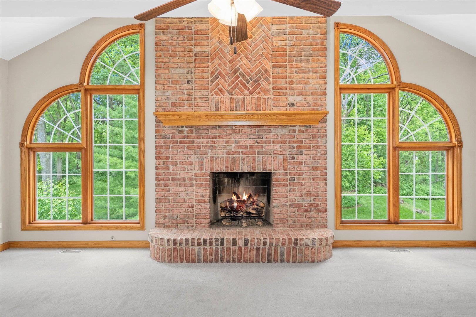 120 Fox Street Cary, IL 60013 - Photo 19 of 56 a living room with a fireplace and a large window