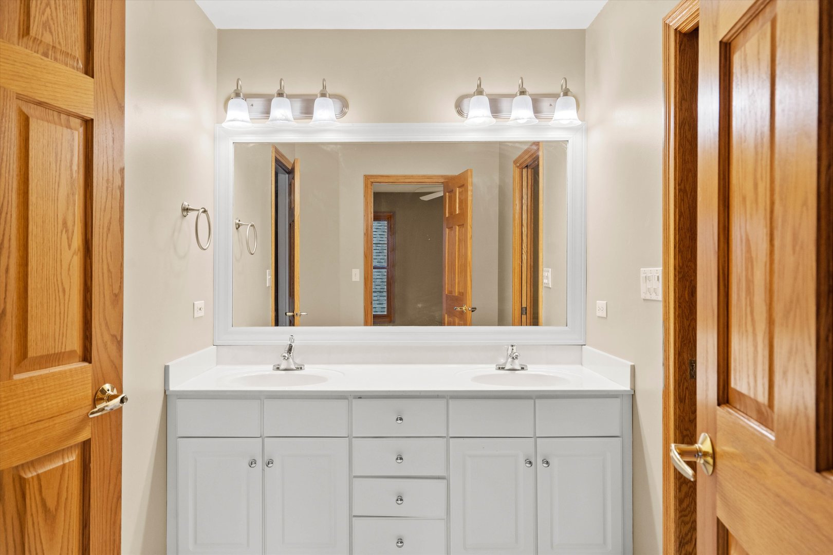 120 Fox Street Cary, IL 60013 - Photo 30 of 56 a bathroom with a double vanity sink and a mirror