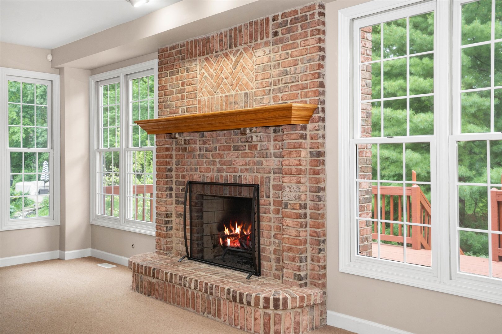 120 Fox Street Cary, IL 60013 - Photo 5 of 56 a living room with a fireplace and a window