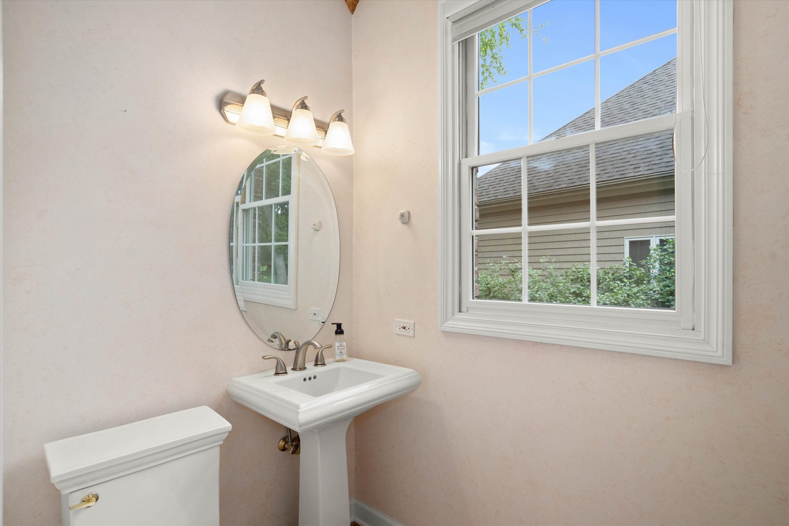 120 Fox Street Cary, IL 60013 - Photo 8 of 56 a bathroom with a sink a toilet and a mirror