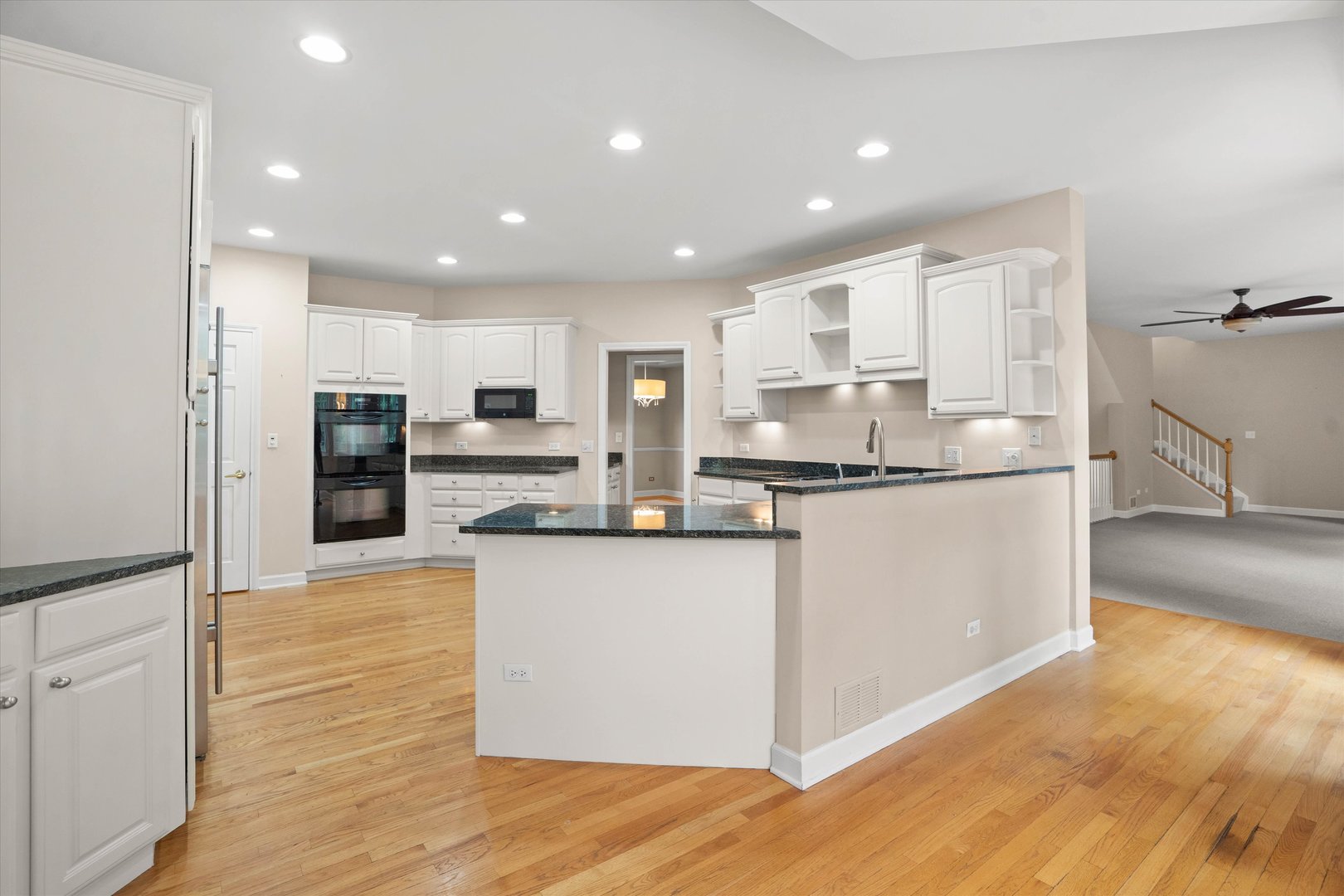 120 Fox Street Cary, IL 60013 - Photo 10 of 56 a kitchen with stainless steel appliances granite countertop a stove and a refrigerator