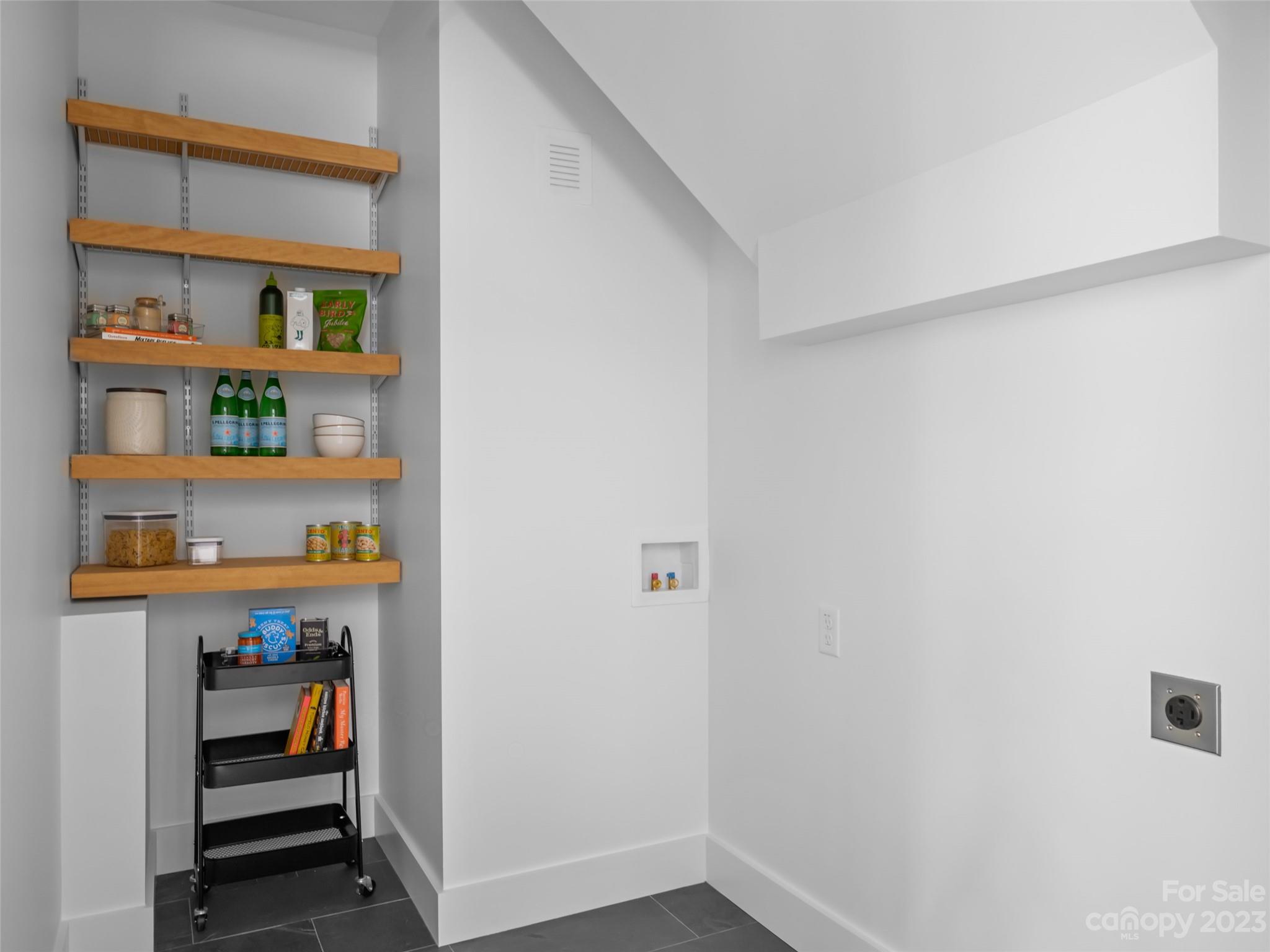 67 Raleigh Road Asheville, NC 28803 - Photo 19 of 43 a view of room with cabinet and shelf