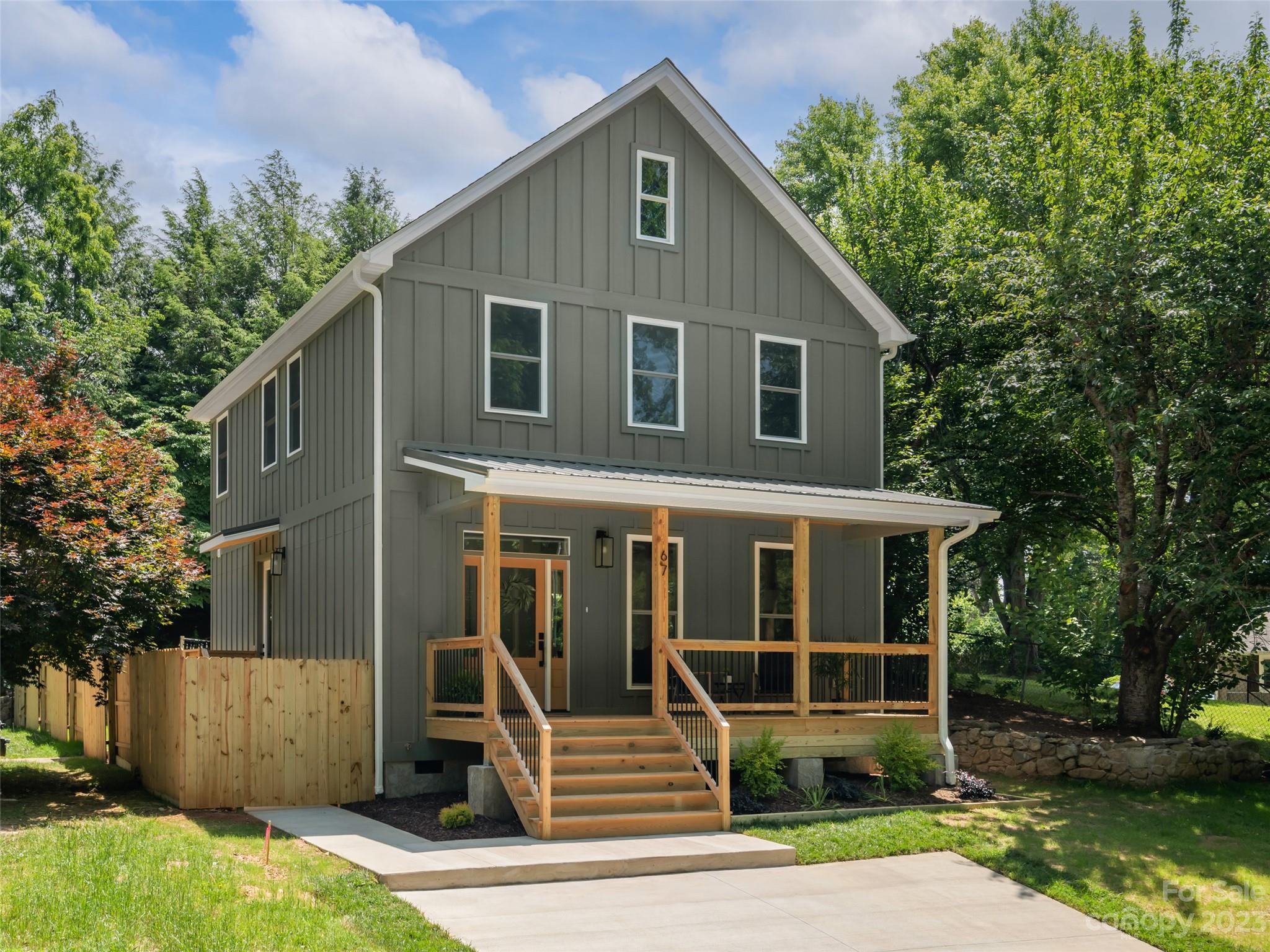 67 Raleigh Road Asheville, NC 28803 - Photo 2 of 43 a front view of a house with a yard