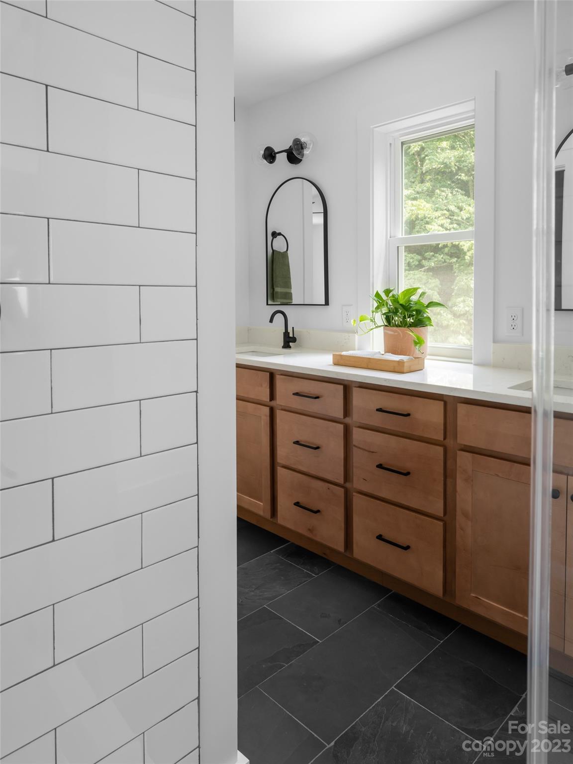 67 Raleigh Road Asheville, NC 28803 - Photo 28 of 43 a bathroom with a sink and a mirror