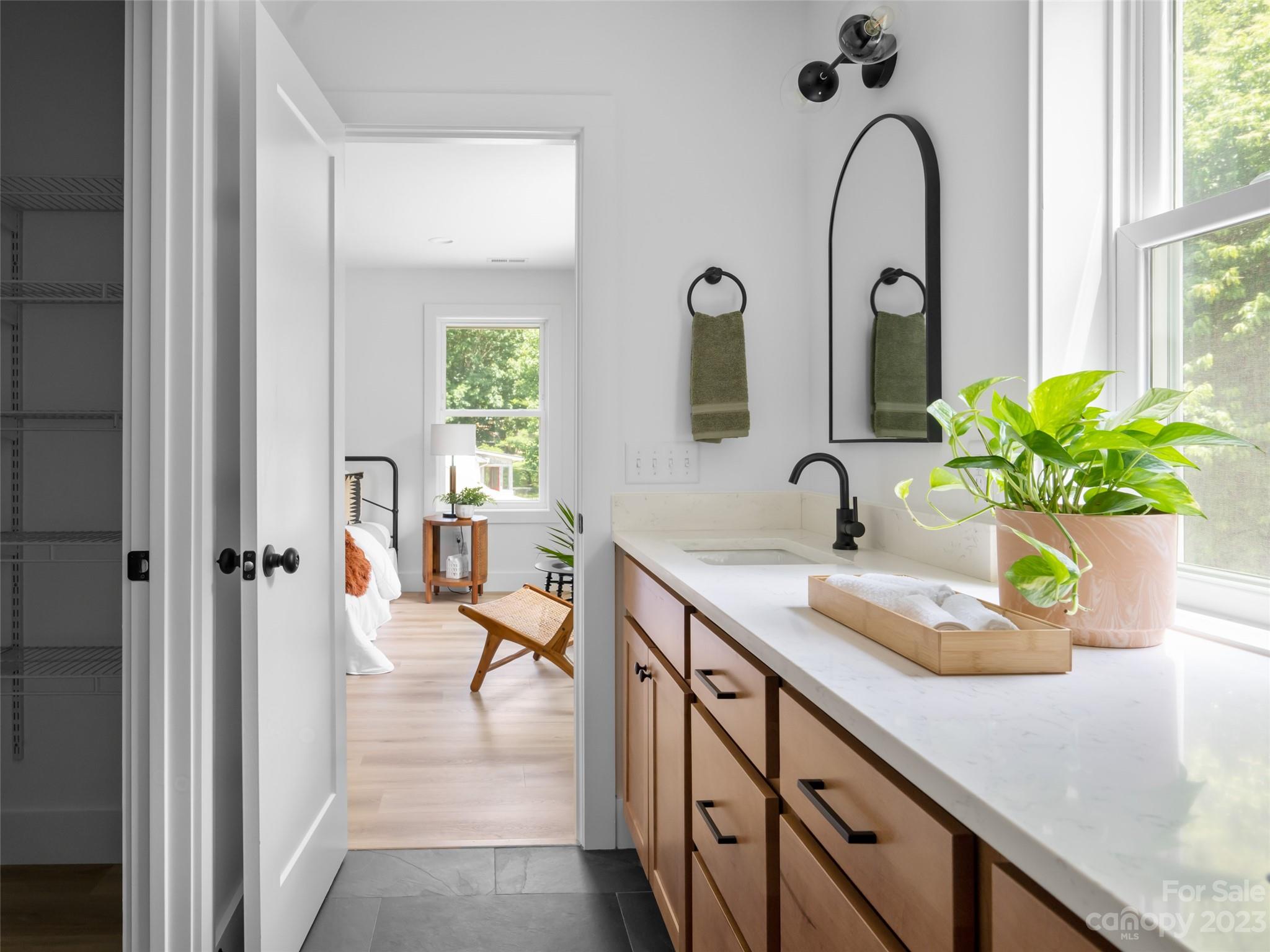 67 Raleigh Road Asheville, NC 28803 - Photo 29 of 43 a view of a bathroom with a tub and window