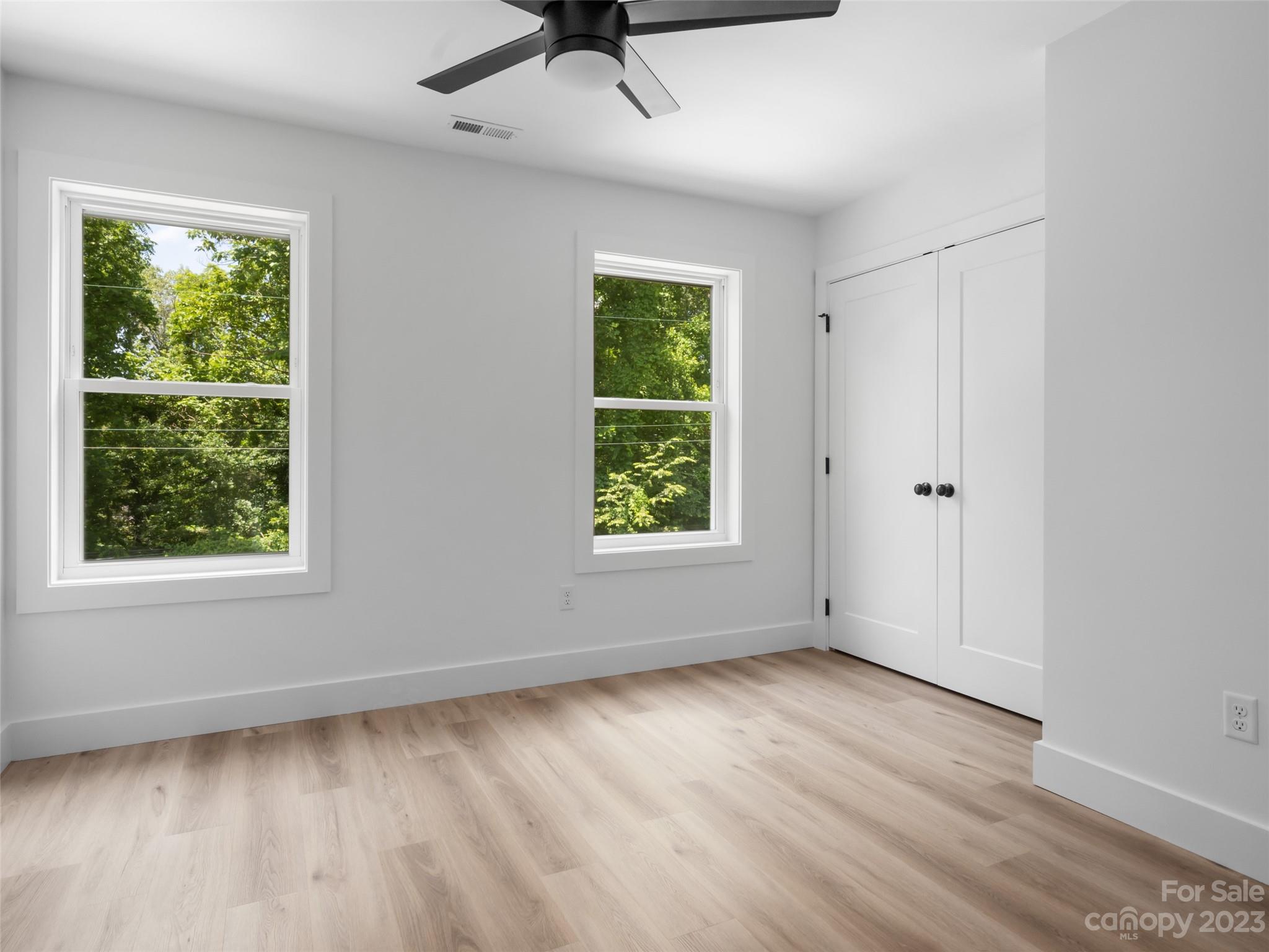 67 Raleigh Road Asheville, NC 28803 - Photo 31 of 43 a view of an empty room with wooden floor and a window