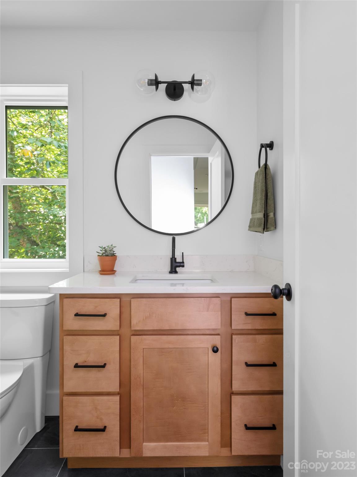 67 Raleigh Road Asheville, NC 28803 - Photo 34 of 43 a bathroom with a sink a vanity and a mirror